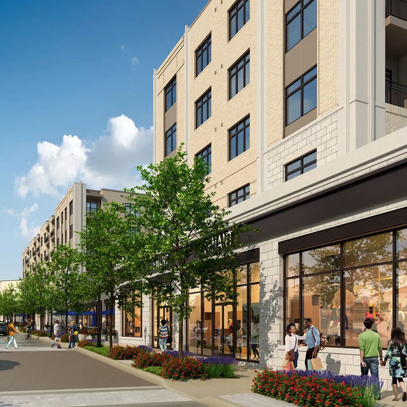 Street-level view of a Coutler Place residence with large windows, storefronts, and people walking and shopping along a landscaped sidewalk with trees and flowers.